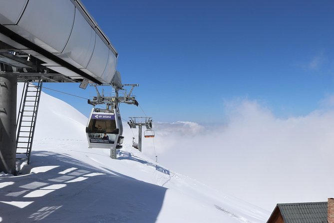 Medeu and Shymbulak ski resort private excursion - Riding the cable car toward Shymbulak