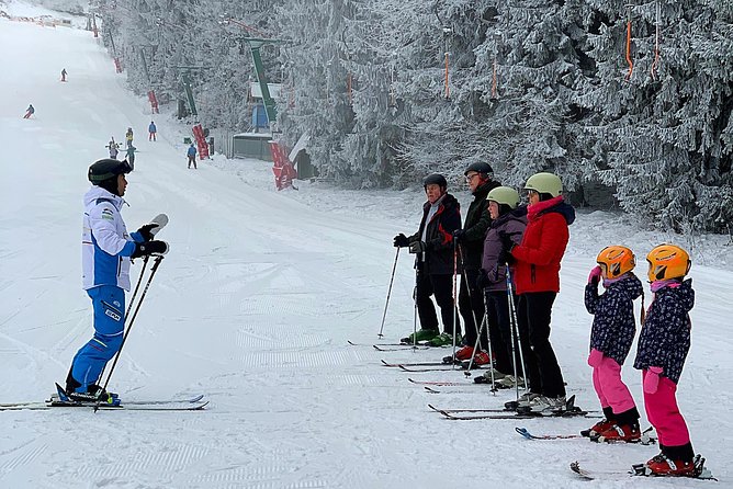 Ski / Snowboard Lessons on the Slopes of Poiana Brasov - Getting fitted at the rental shop
